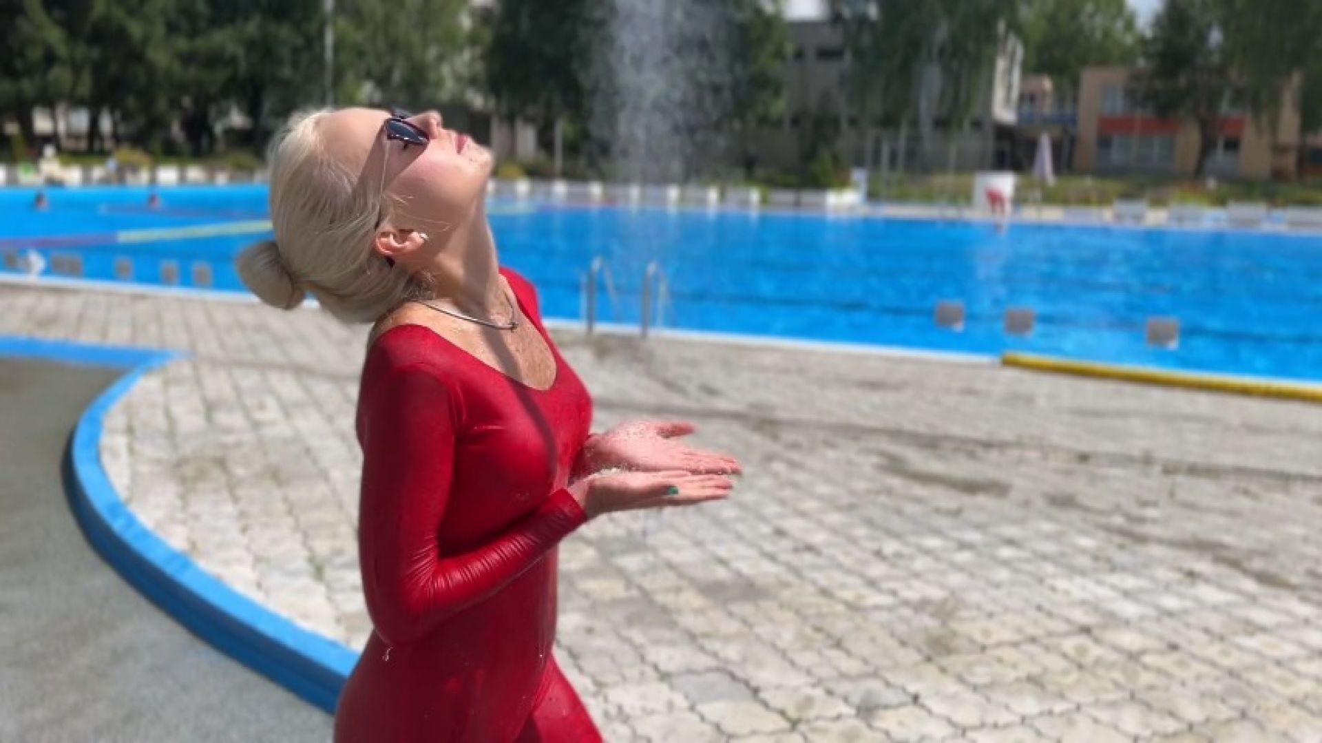 Wet spandex suit and outdoor shower