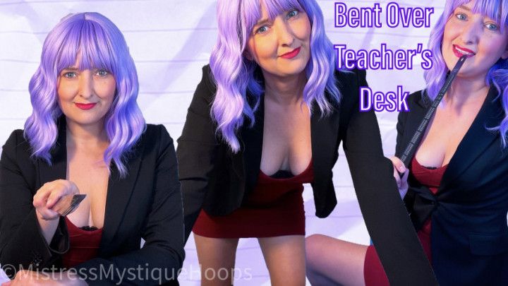 Bent Over Teacher's Desk