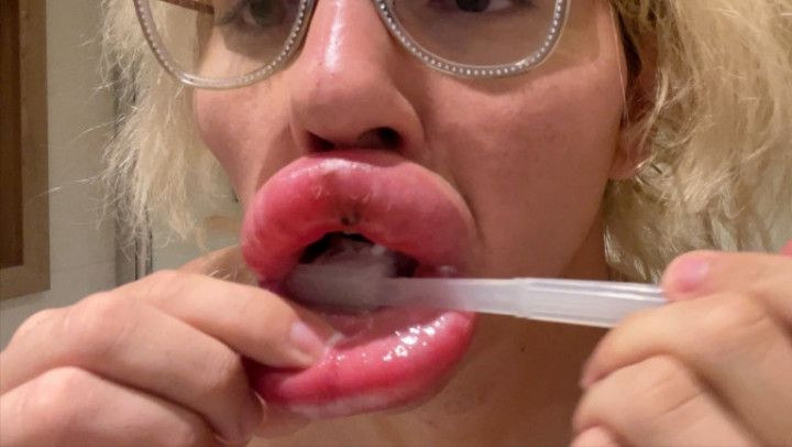 Brushing my Swollen Bimbo Lips