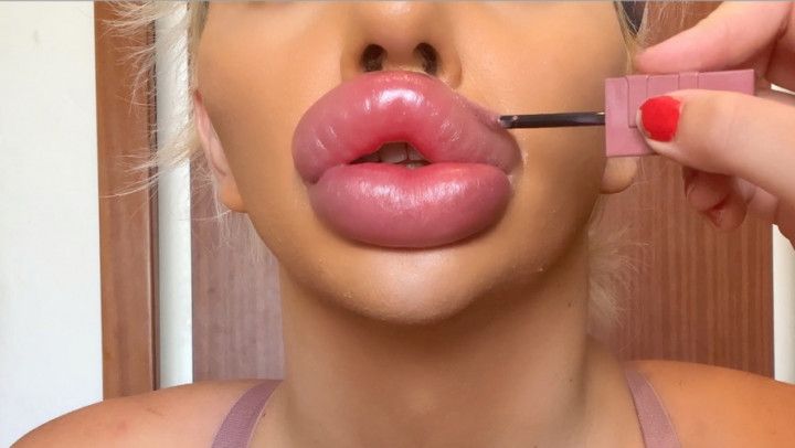 Applying Lipgloss and Lipstick on massive fake Lips