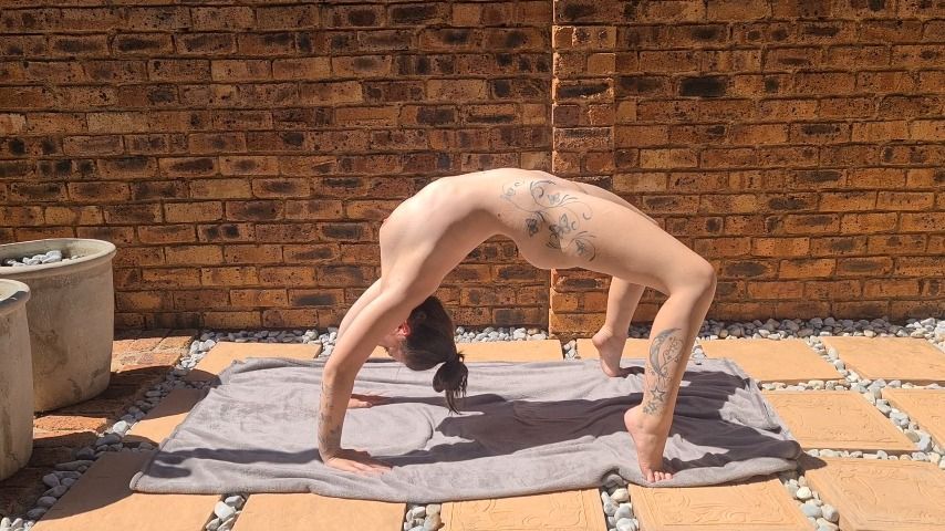 Naked stretching outside in the sun