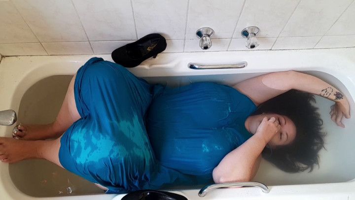 Heels and blue dress drenched in the tub