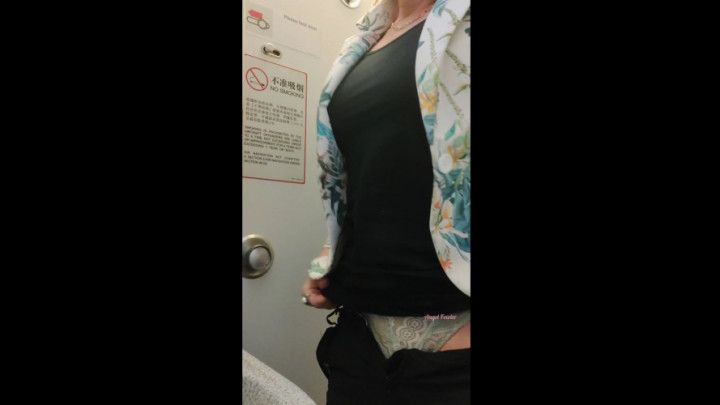 Traveling milf on her monthlies pees in the airplane toilet