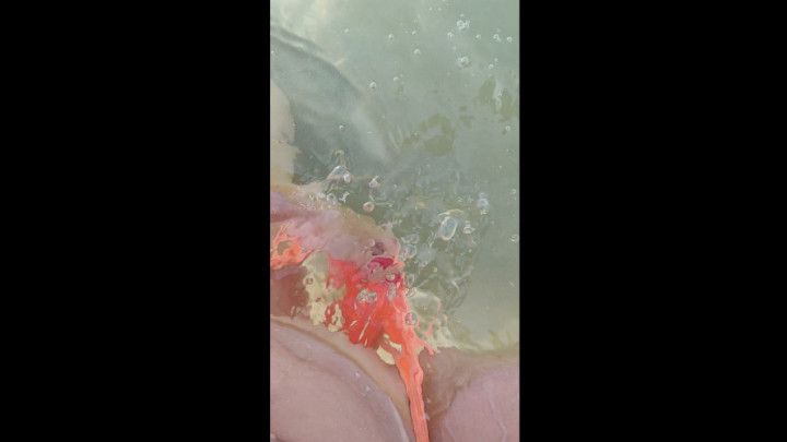 Hairy milf pisses in the sand and rinses pussy in the sea