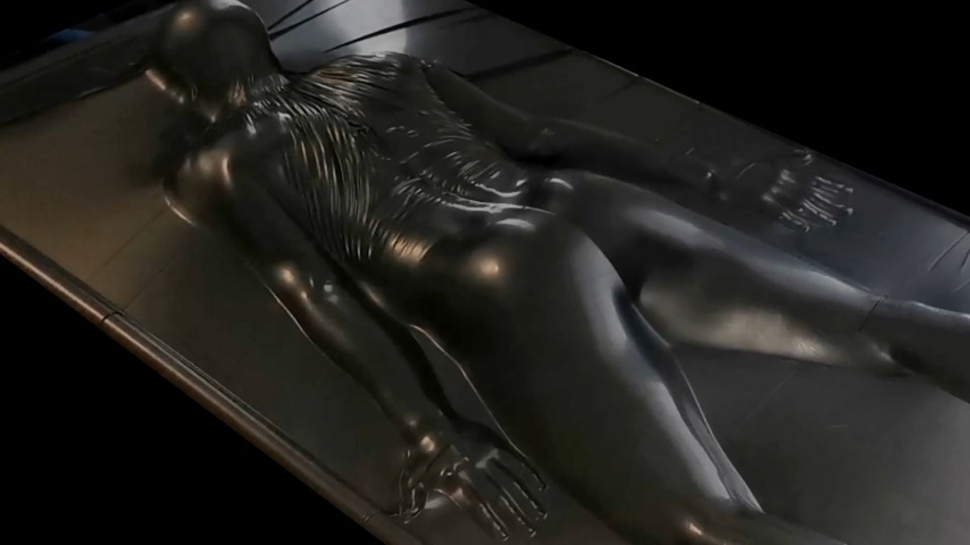 Sealed face down in a skintight black vacbed