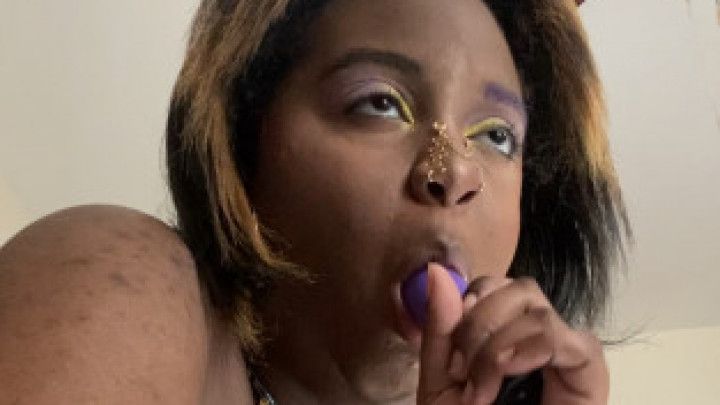 Fat Ebony Sucks on Purple Vibrator