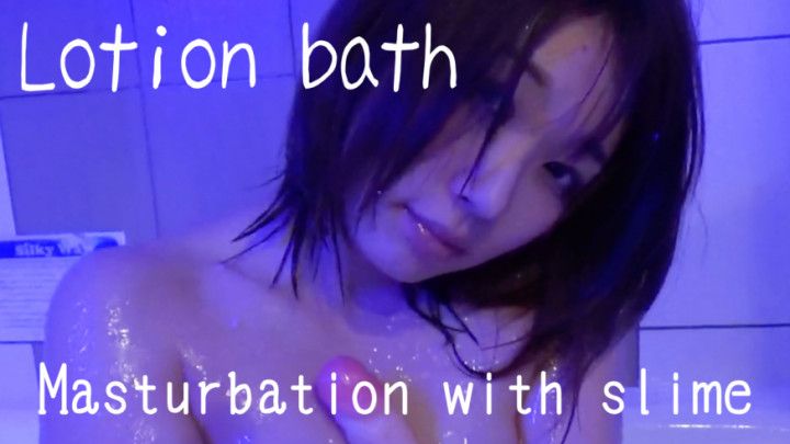 Slippery masturbation in a lotion bath