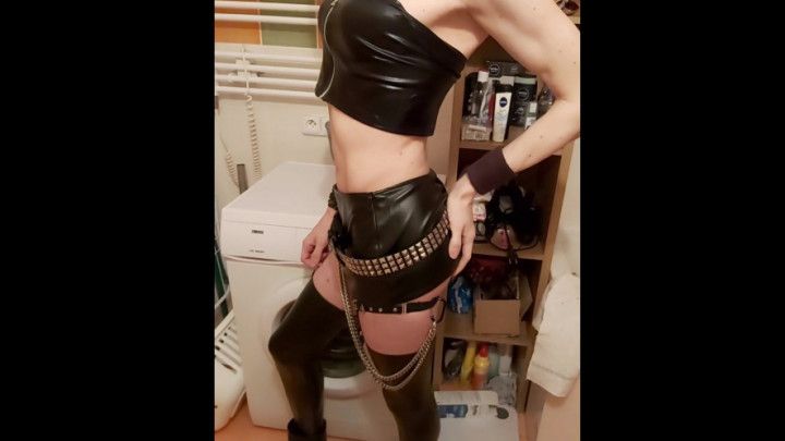 Femboy masturbating in a leather skirt