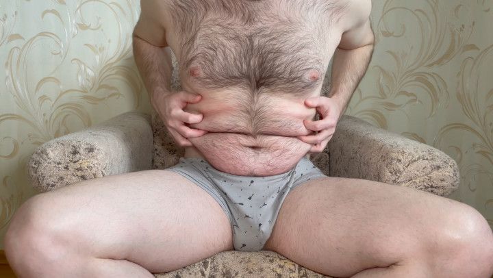 Hairy guy plays with his belly