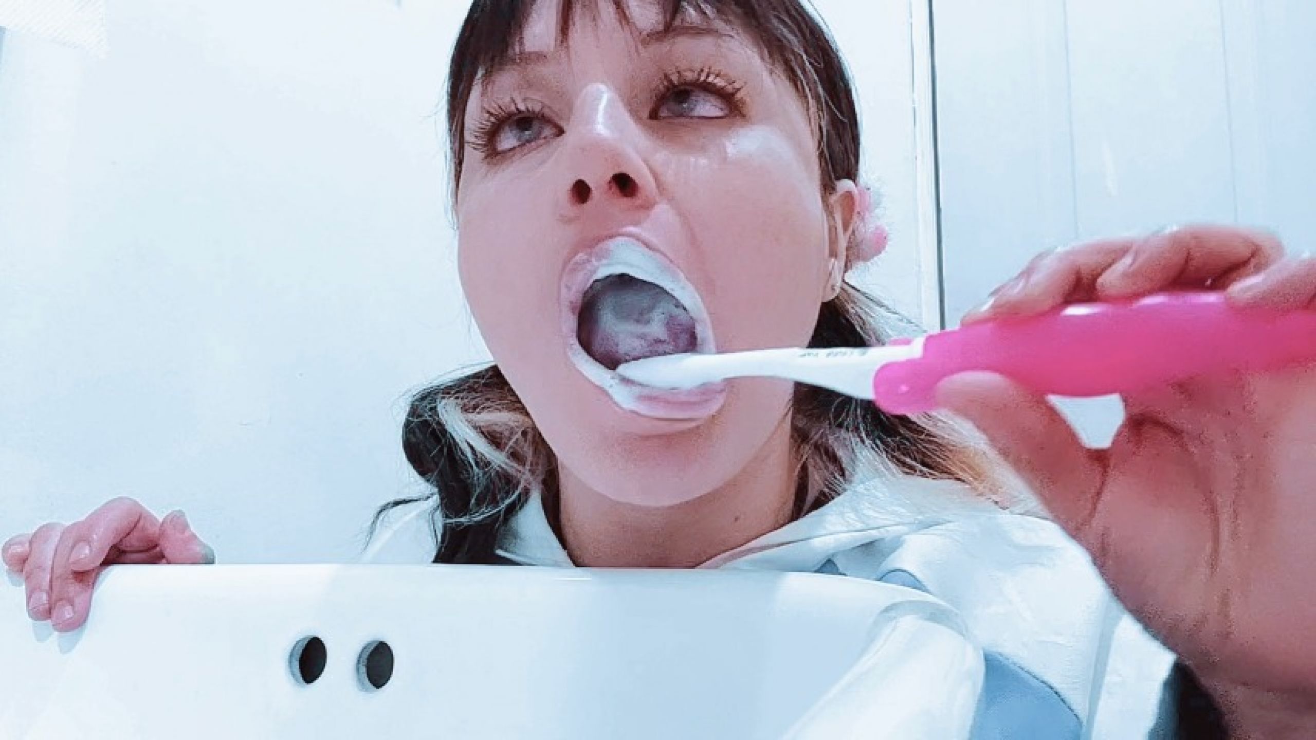 Hinata is brushing her teeth