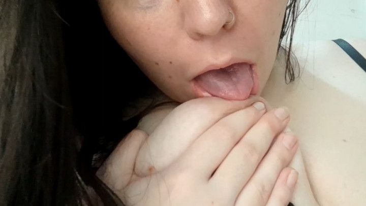 Sexy giantess sucks her own tits and moans