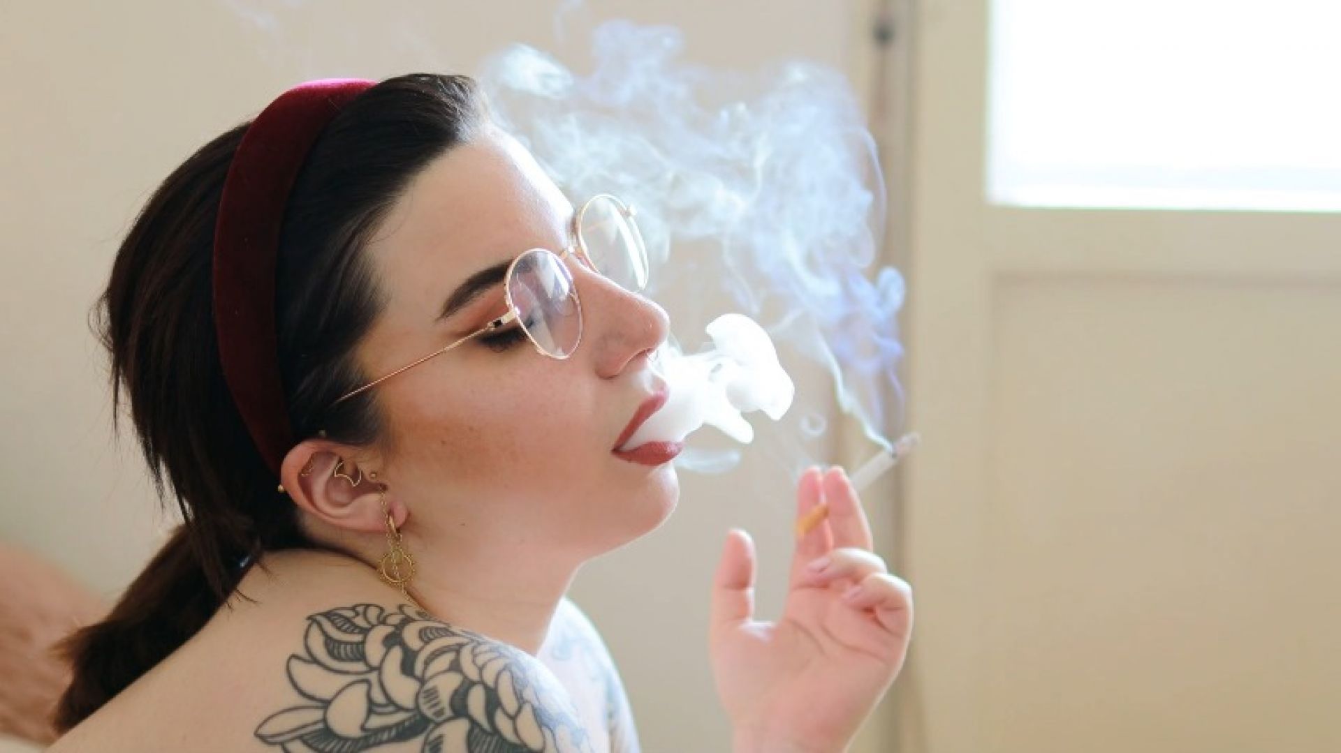 Tattooed Naked Smoking Model