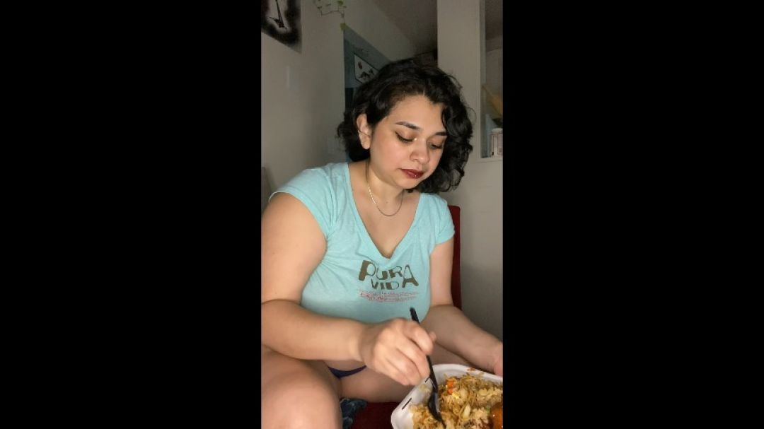 Latina Eating A Big Plate Of Chinese Food