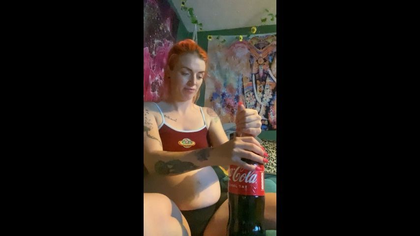 Bottle of Coke pregnant with burps