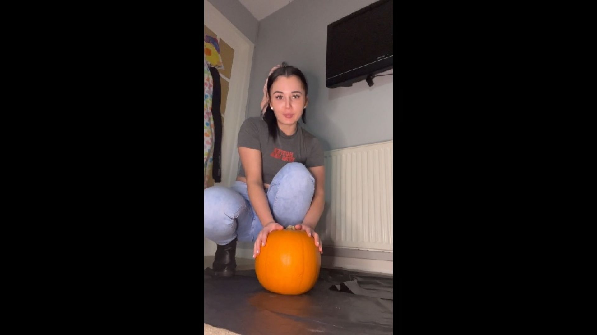 Stomping on pumpkin in booted heels