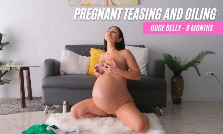 Pregnant striptease with oiling and flashing