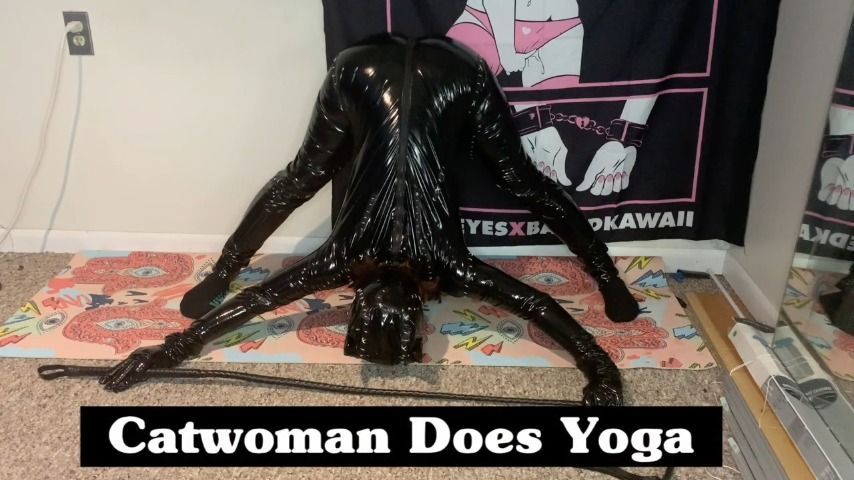 Cat Woman does yoga in her latex suit