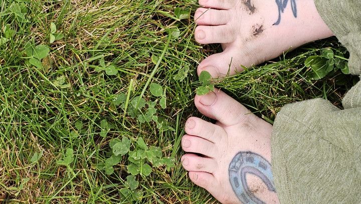 Dirty feet in the grass