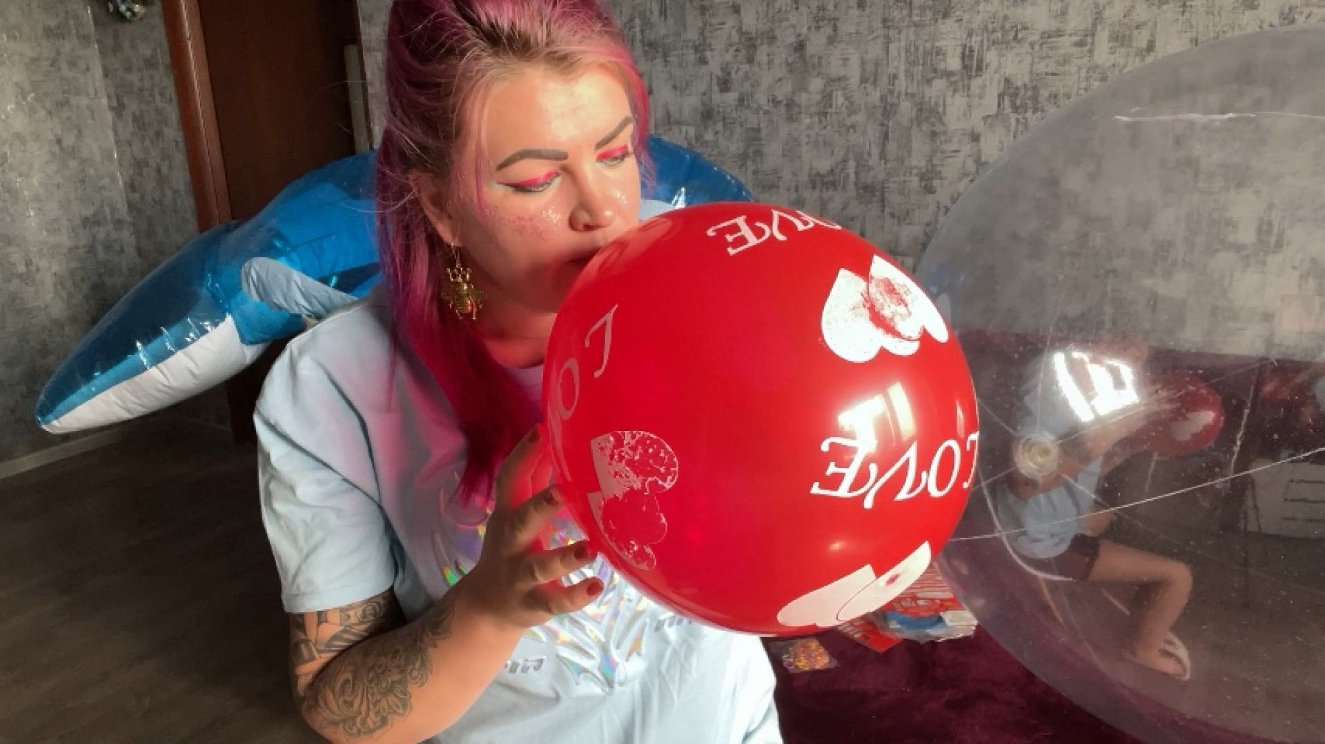 Girl blow 11 red balloon