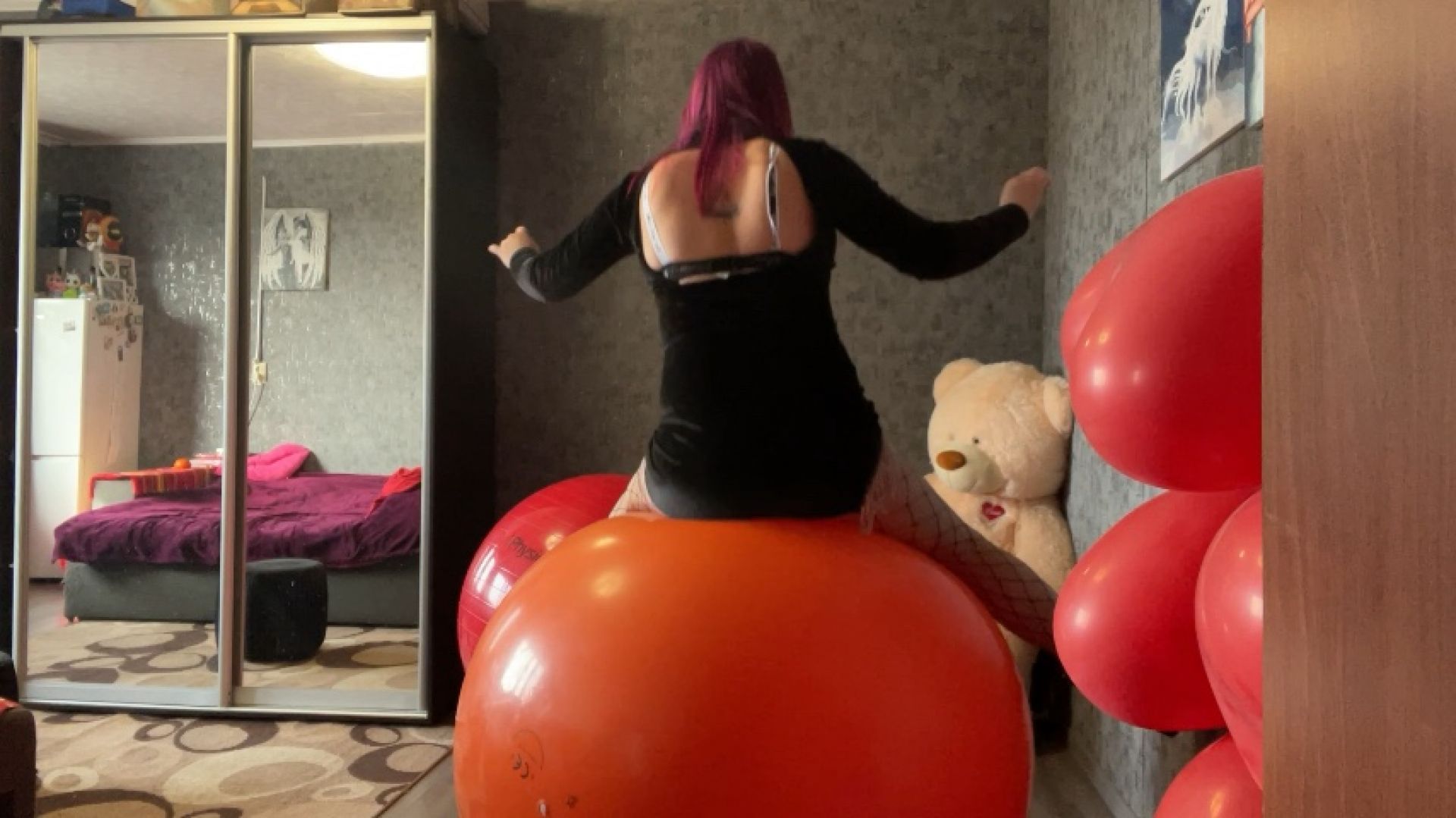 Sexy loner in dress ride on gym ball