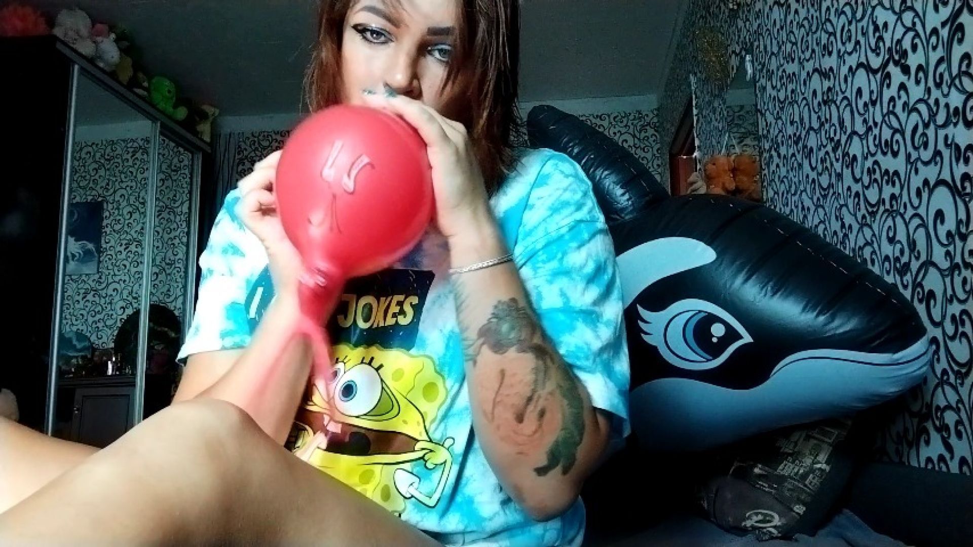 girl blowing animals balloons