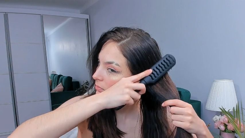 cute teen brushing her hair