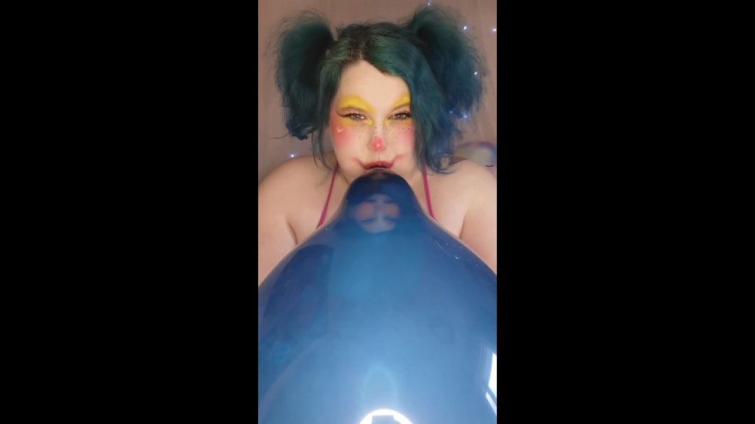 Silly BBW clown blowing up balloon