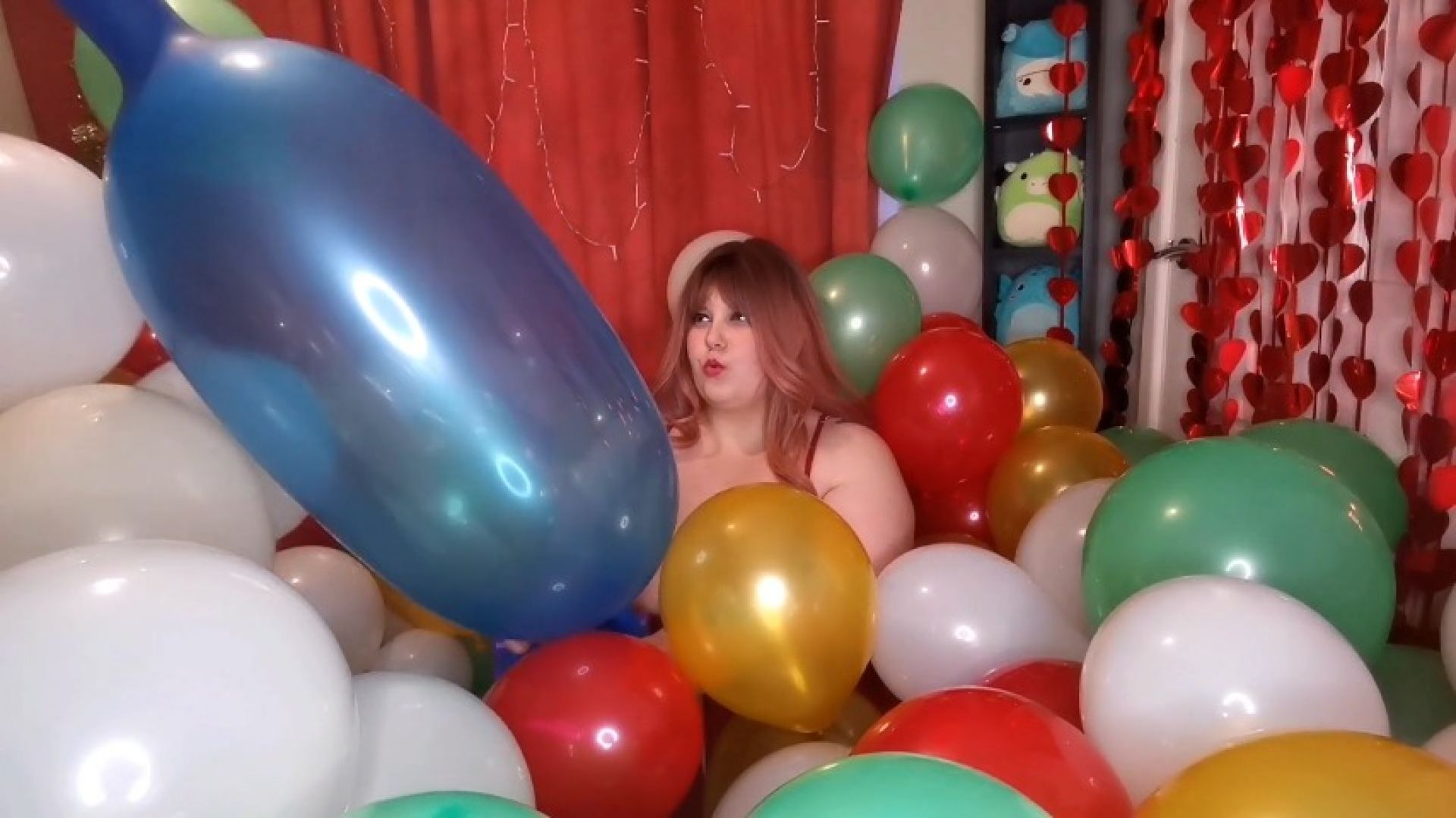 JOI surrounded by balloons