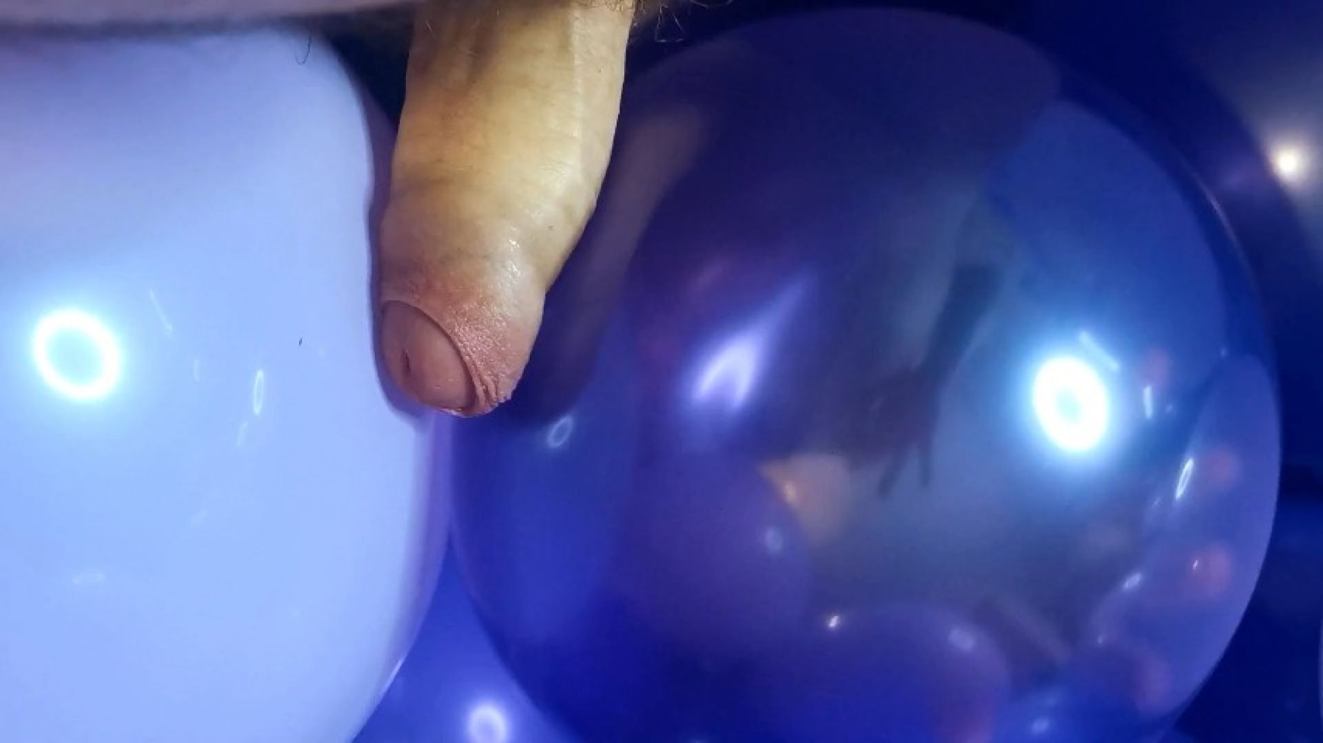 Stroking cock with balloons