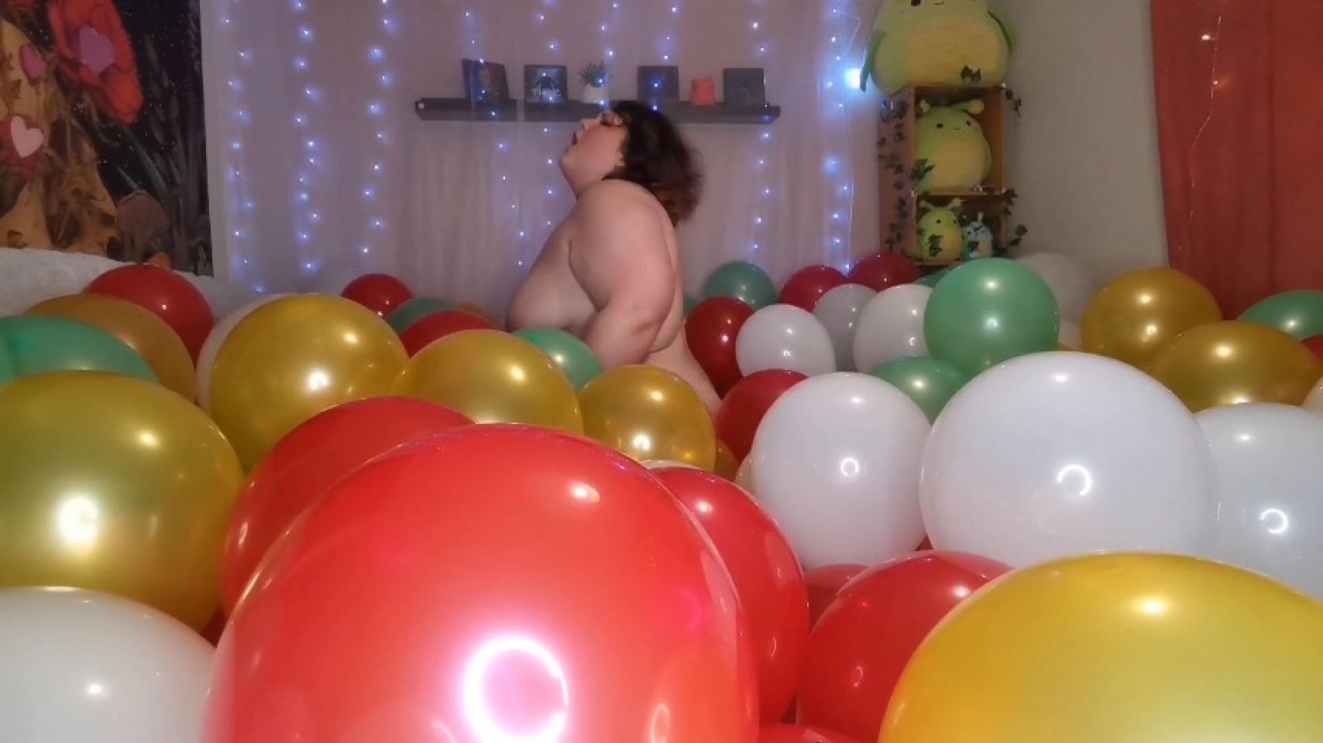 Riding cock in a sea of latex balloons