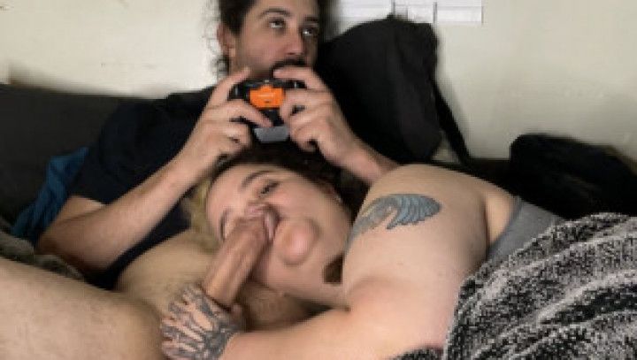 Wife sucking husbands dick while he play