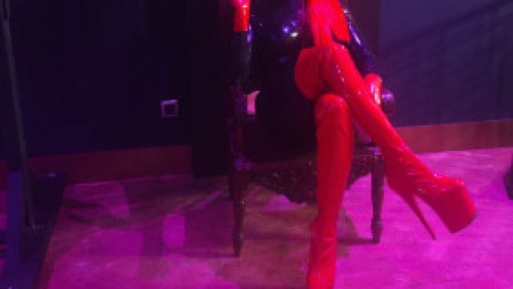 Dominatrix smoking in her dungeon