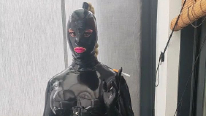 Tania smoking and masturbating full Latex encasement