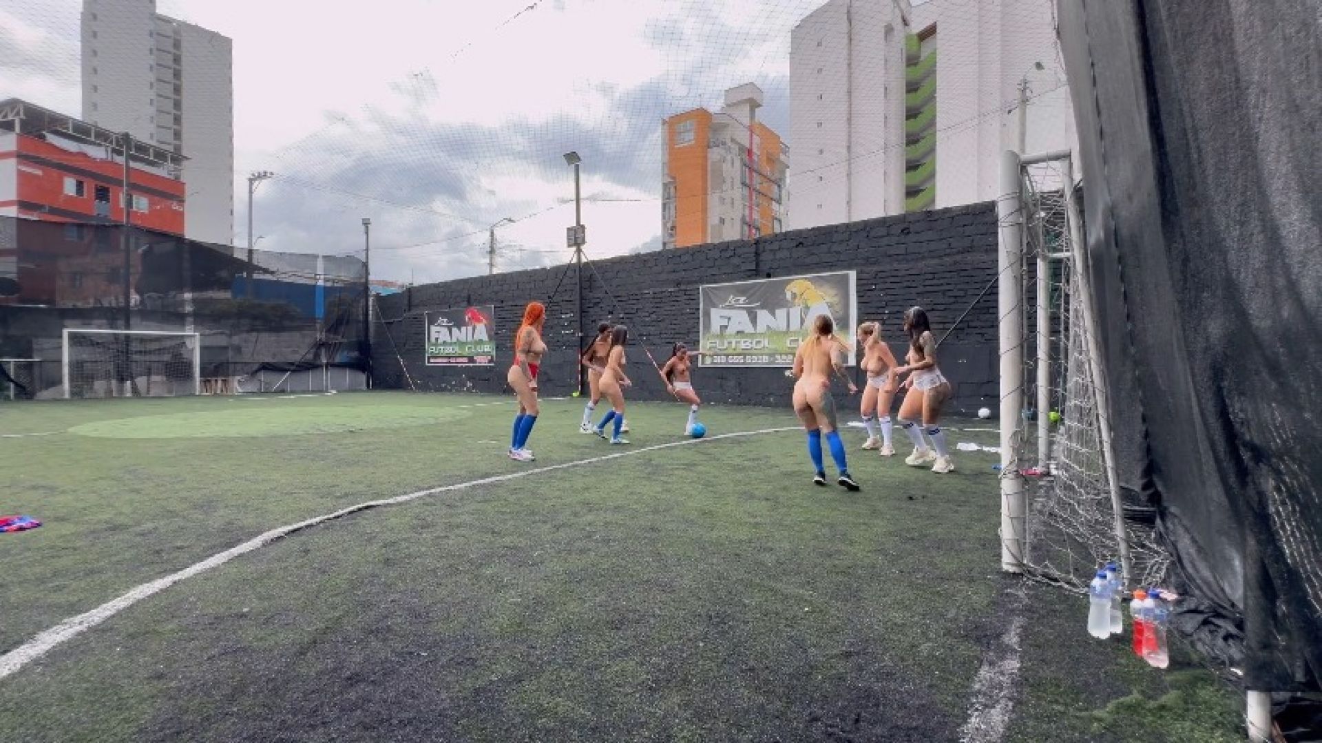 7 horny girls getting naked on the soccer field