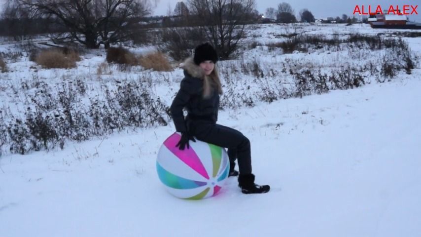 Playing with a beach ball in winter