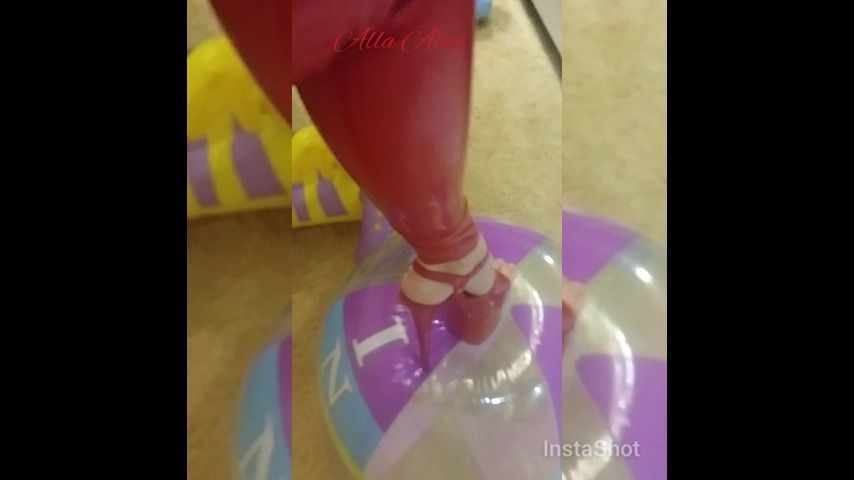 RED LATEX CATSUITE AND BEACH BALL