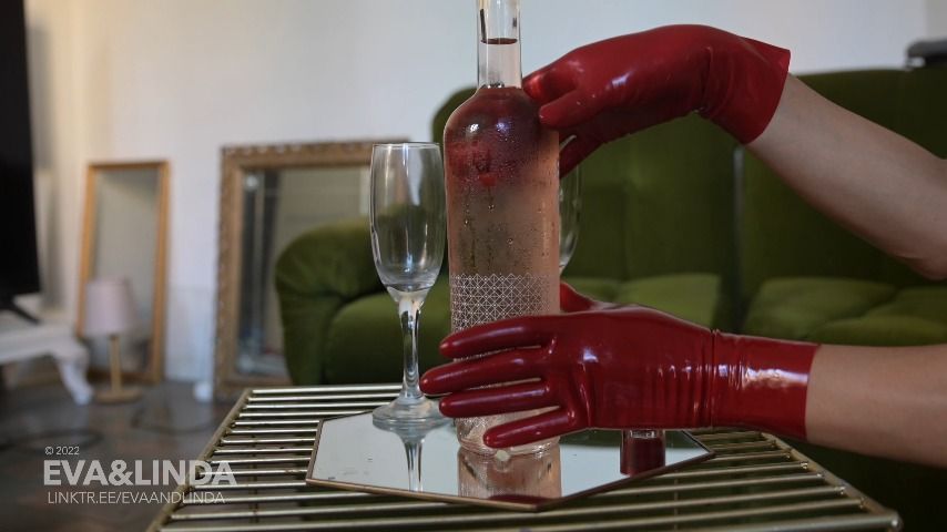 Linda strokes a bottle in latex gloves