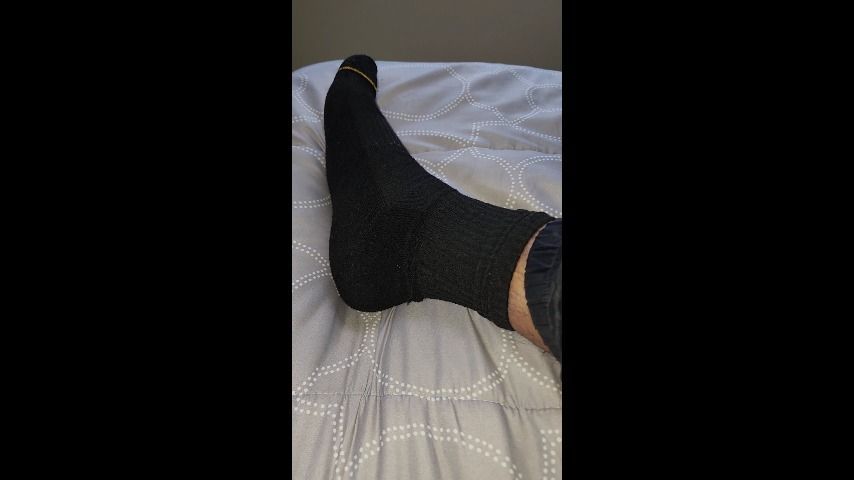 Black sock foot tease