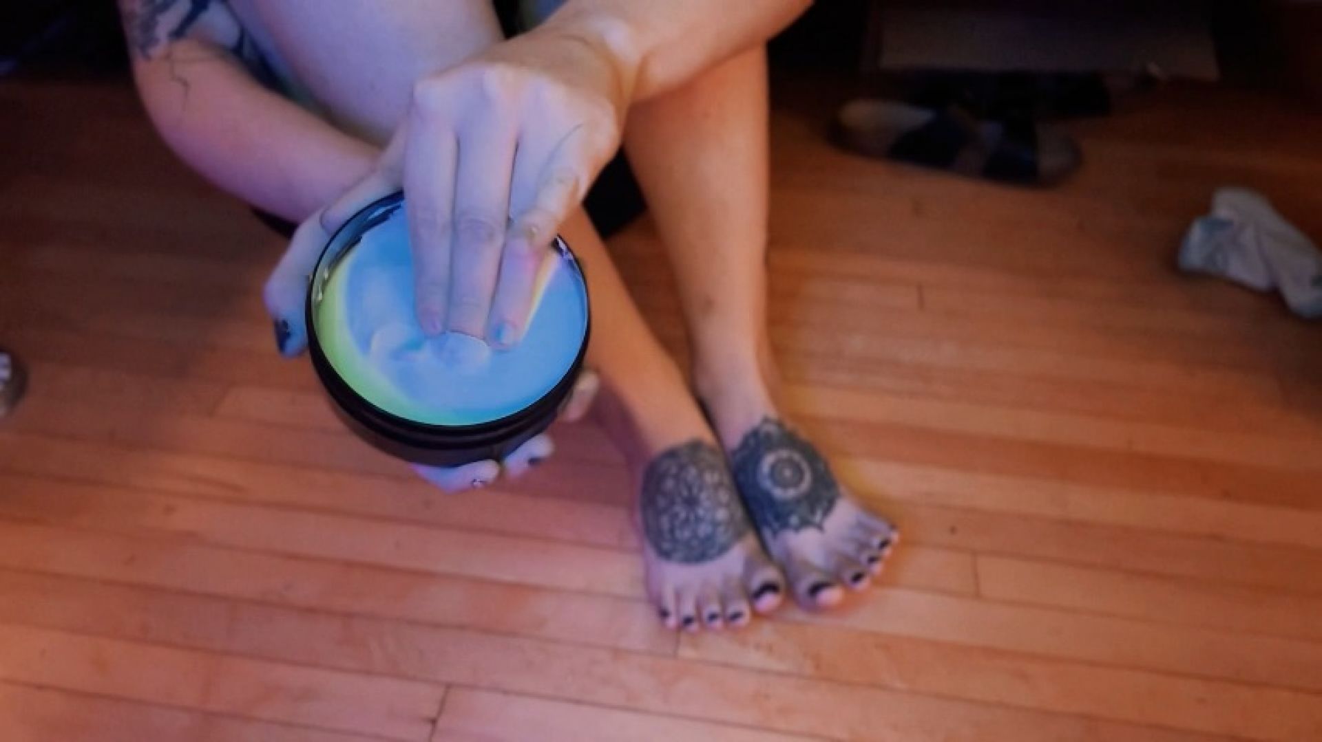 inked feet get lotioned up