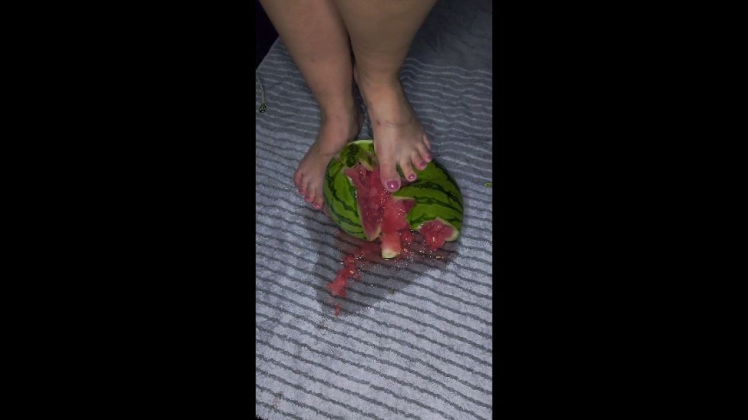 Smashing watermelon with heels and bare foot