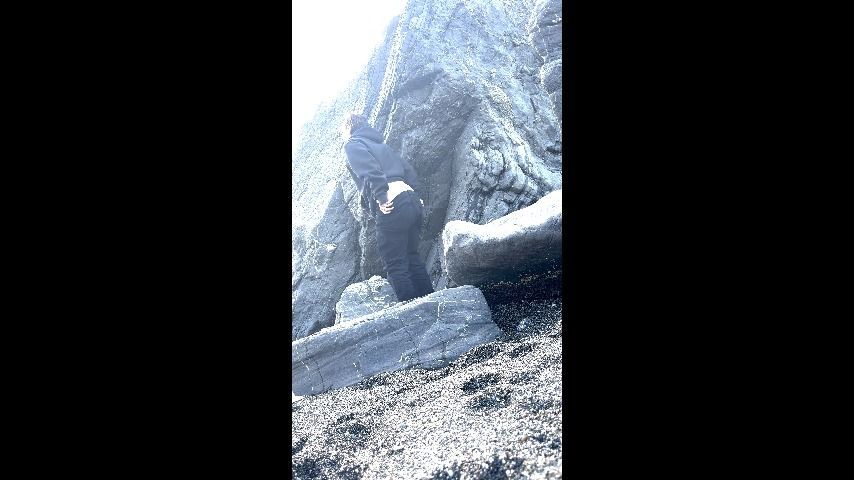 girl peeing at beach