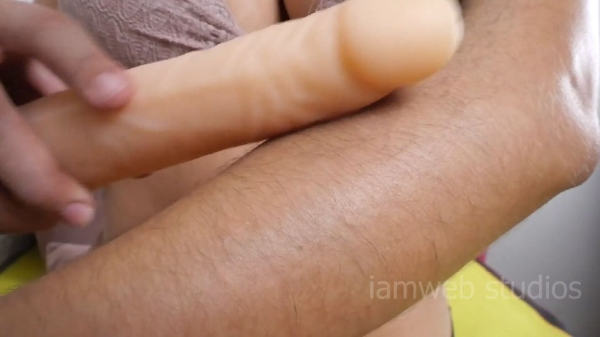 Hairy beauty play with dildos and oil on arms