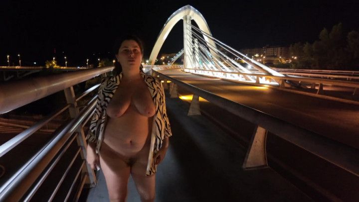 Luscious Milf walks without Bra and Panties on the Bridge