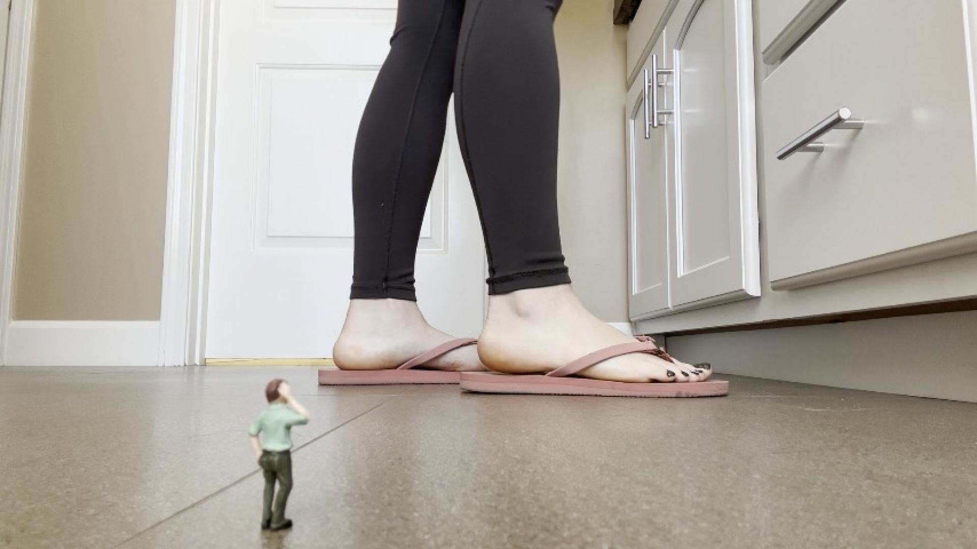 Giantess Dominates Tiny Man Under Her Feet