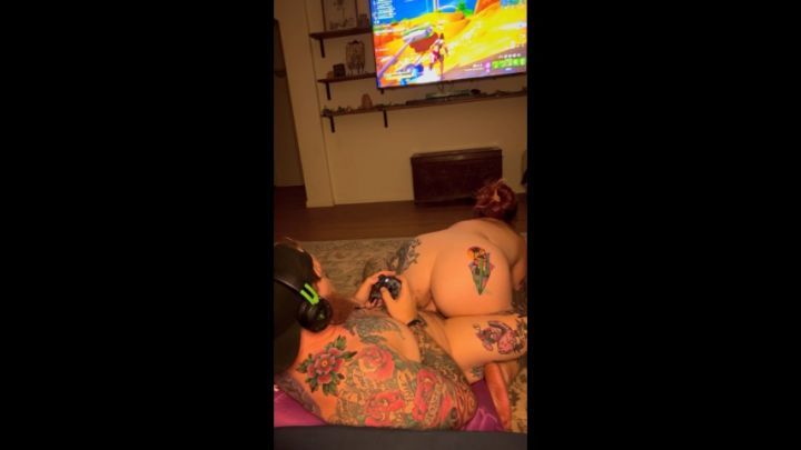 tattooed redhead sucks + fucks while he plays video games