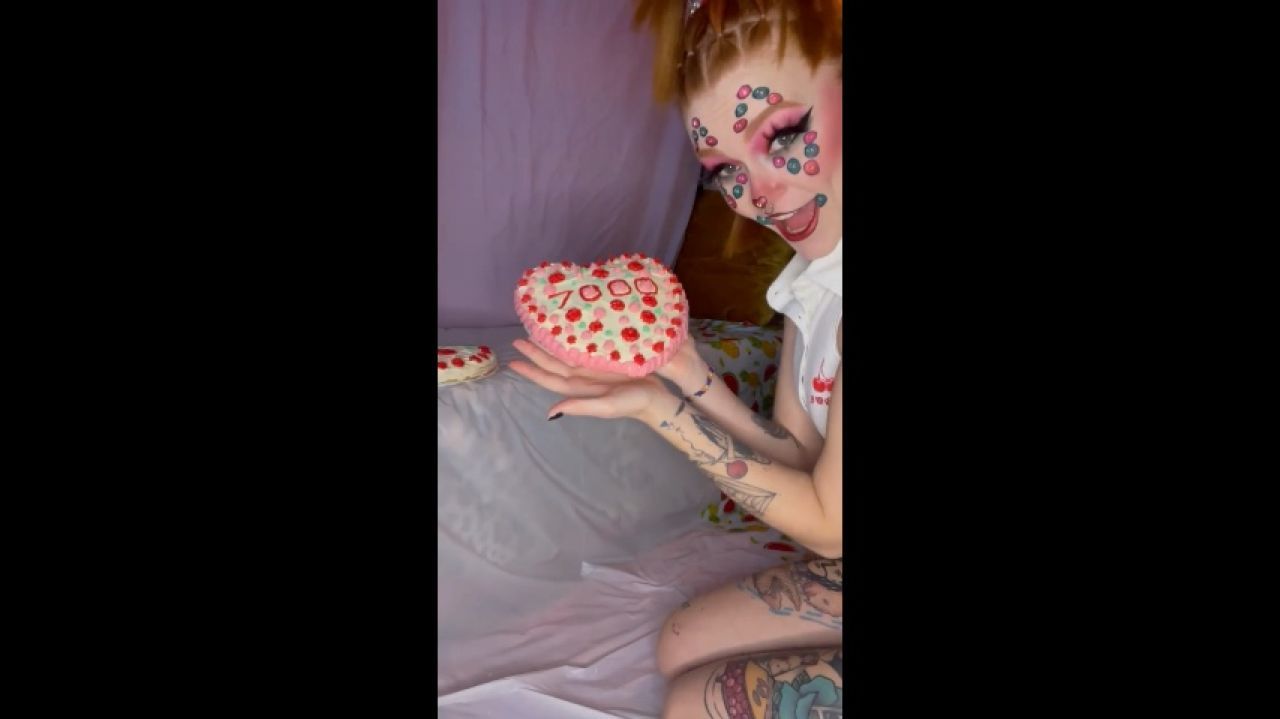 Cake Sitting In Clown Paint