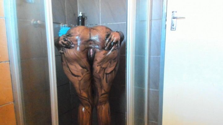 Ebony big booty body scrubbing with charcoal in the shower