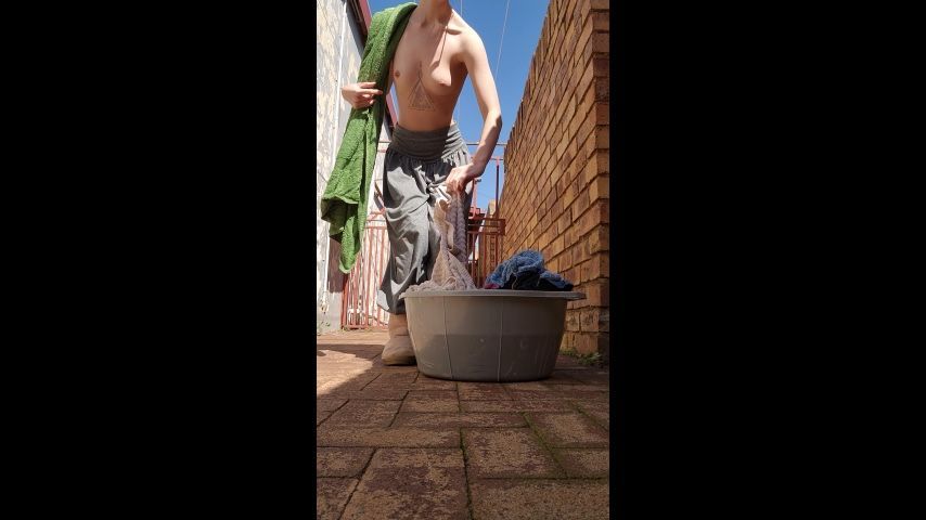 Hanging up washing Topless