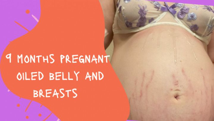 9 months pregnant oiled belly and breasts