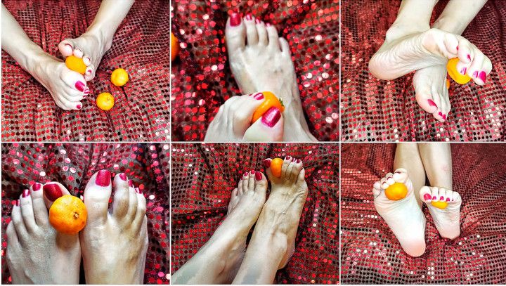 The feet are playing with a tangerine